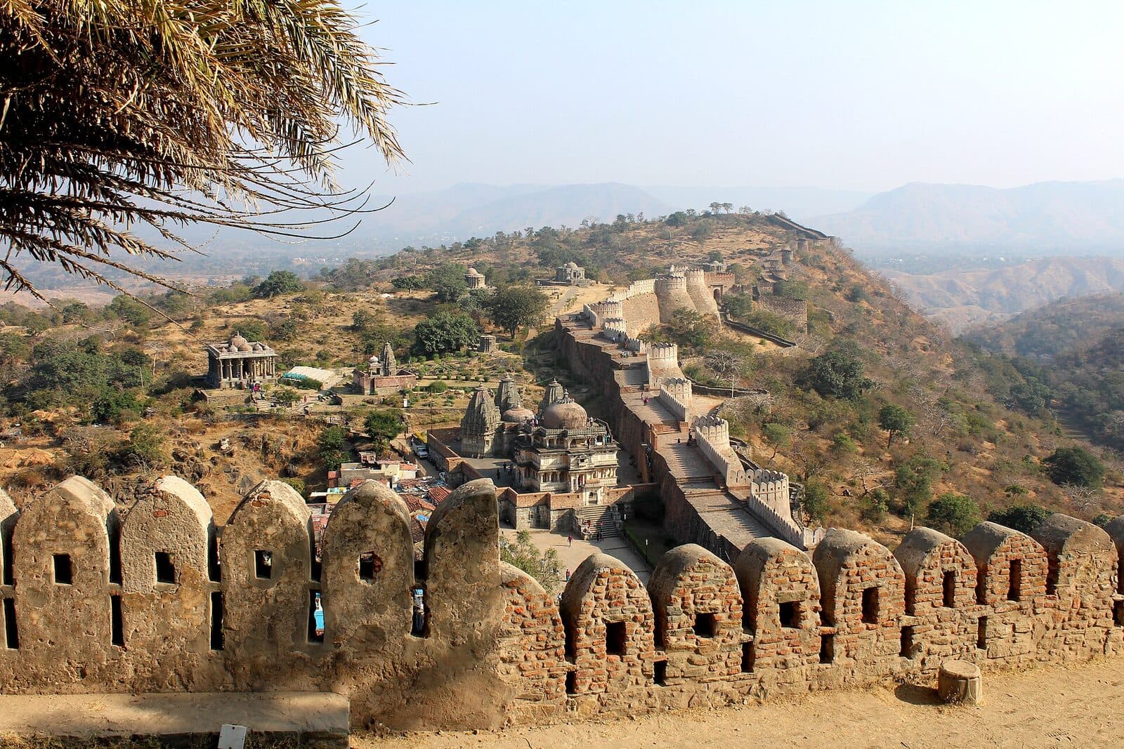 The crenellated walls of Kumbhalgarh Fort winding over the Aravalli hills